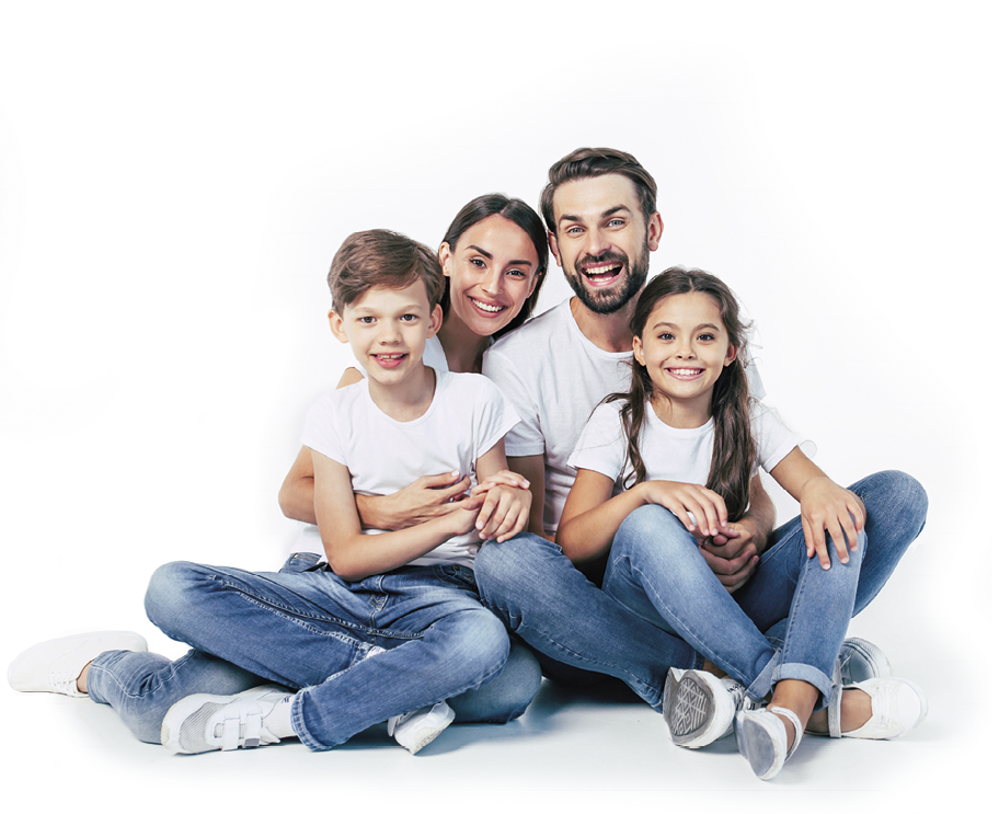 Beautiful and happy smiling young family in white T-shirts are hugging and have a fun time together while sitting on the floor and looking on camera